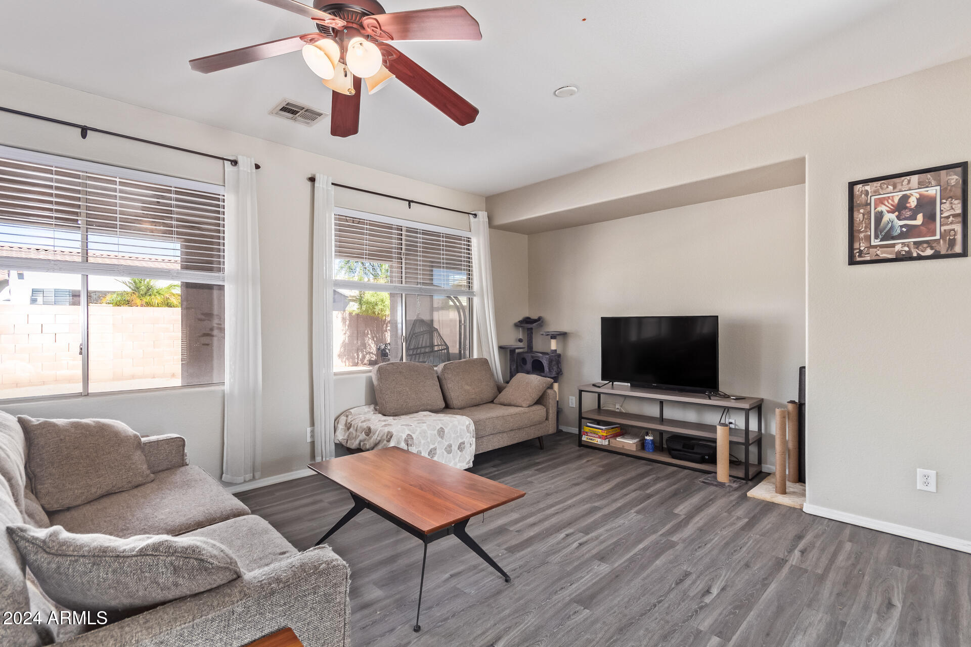 18750 East Ryan Road Queen Creek, AZ 85142 - Photo 7 of 36 a living room with furniture and a flat screen tv