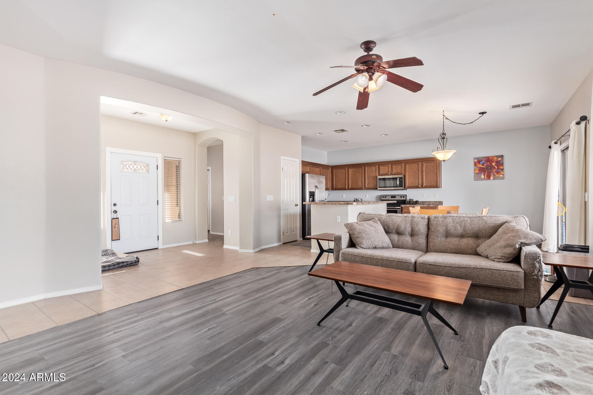 18750 East Ryan Road Queen Creek, AZ 85142 - Photo 10 of 36 a living room with furniture and kitchen view