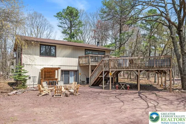 a view of a house with a patio and a slide