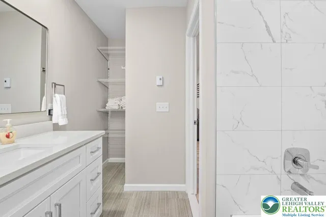 a bathroom with a sink and a mirror