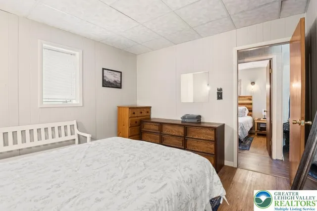 a bedroom with a bed and a table in it