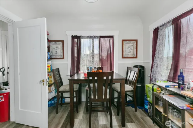 a view of a dining room with furniture and window