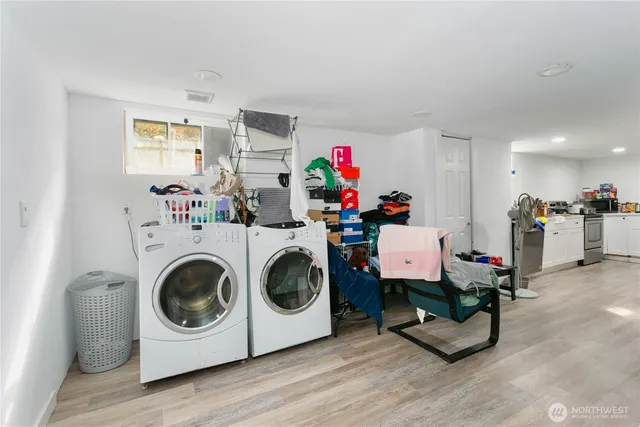 a utility room with toys and wooden floor
