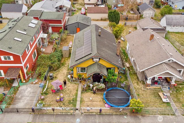 an aerial view of houses with outdoor space