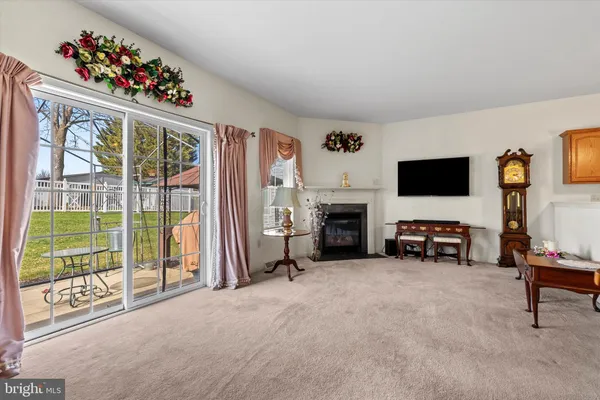 a view of a livingroom with toys and a fireplace
