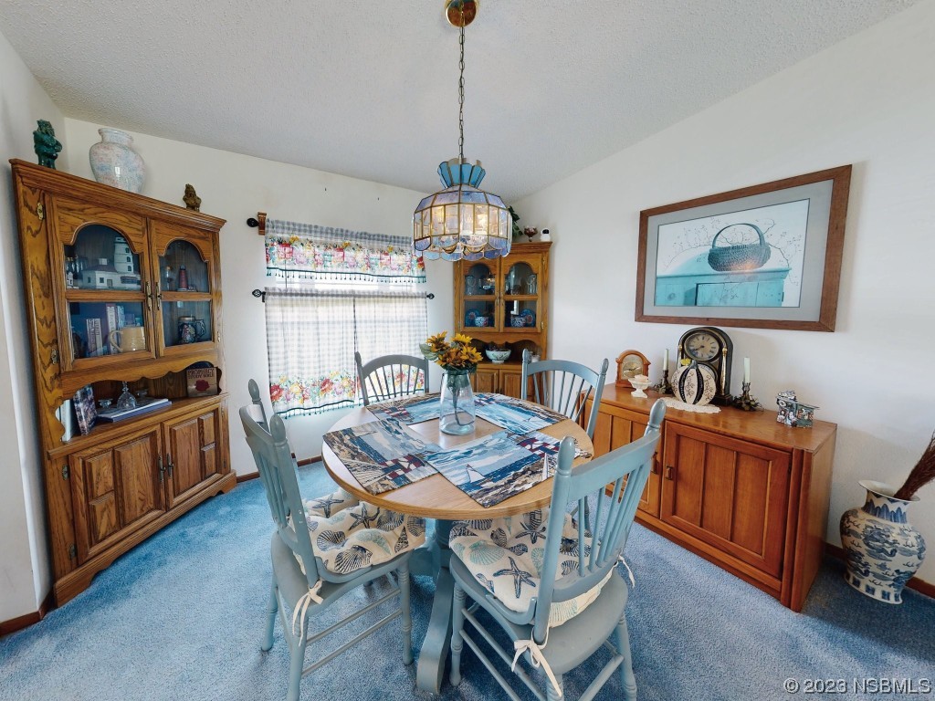 700 Starboard Avenue Edgewater, FL 32141 - Photo 16 of 47 a dining room with furniture and window