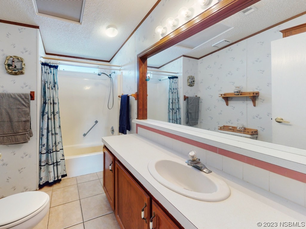 700 Starboard Avenue Edgewater, FL 32141 - Photo 20 of 47 a bathroom with a sink a toilet and shower