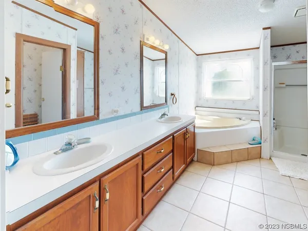 a bathroom with a tub and a window