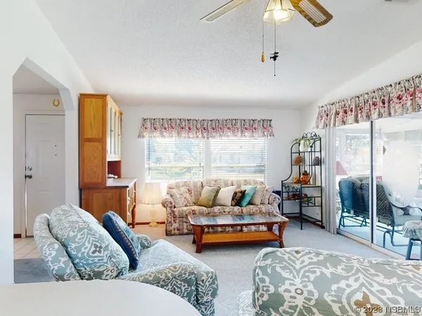 a living room with furniture and a table