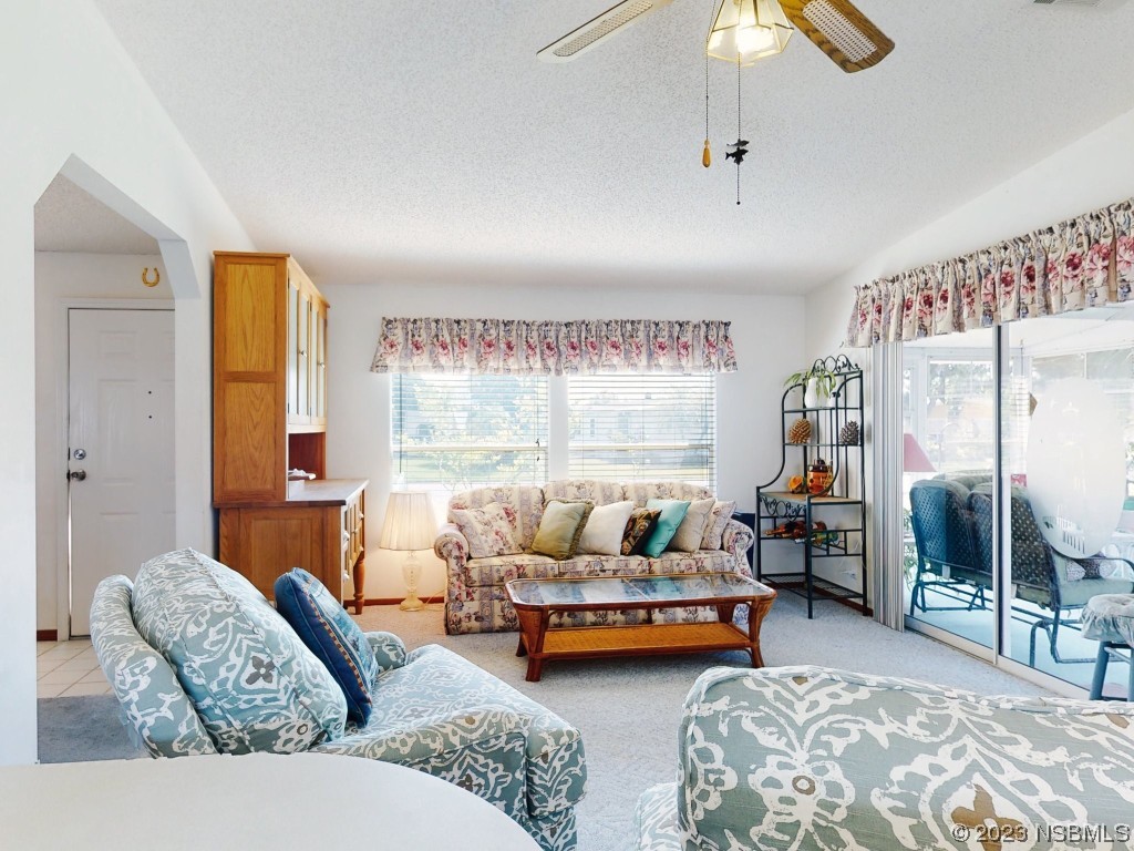 700 Starboard Avenue Edgewater, FL 32141 - Photo 3 of 47 a living room with furniture and a table