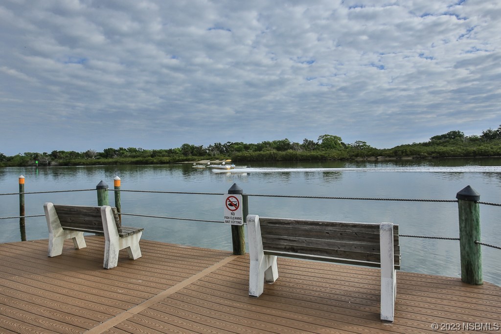 700 Starboard Avenue Edgewater, FL 32141 - Photo 33 of 47 a view of a lake with wooden deck and city view