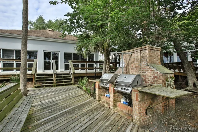 a view of swimming pool with seating space and wooden floor