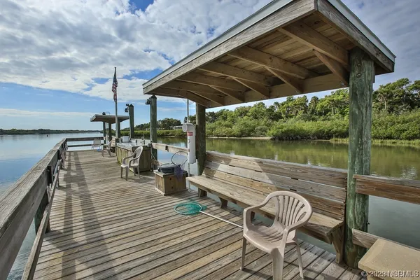 a view of a swimming pool with a patio