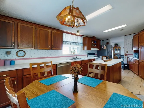 a kitchen with a sink cabinets and window
