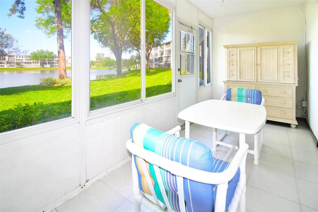 1055 Cambridge C, Unit 1055 Deerfield Beach, FL 33442 - Photo 19 of 52 Bright Enclosed Patio