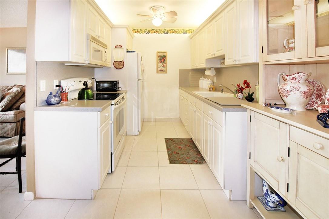 1055 Cambridge C, Unit 1055 Deerfield Beach, FL 33442 - Photo 8 of 52 Galley Kitchen