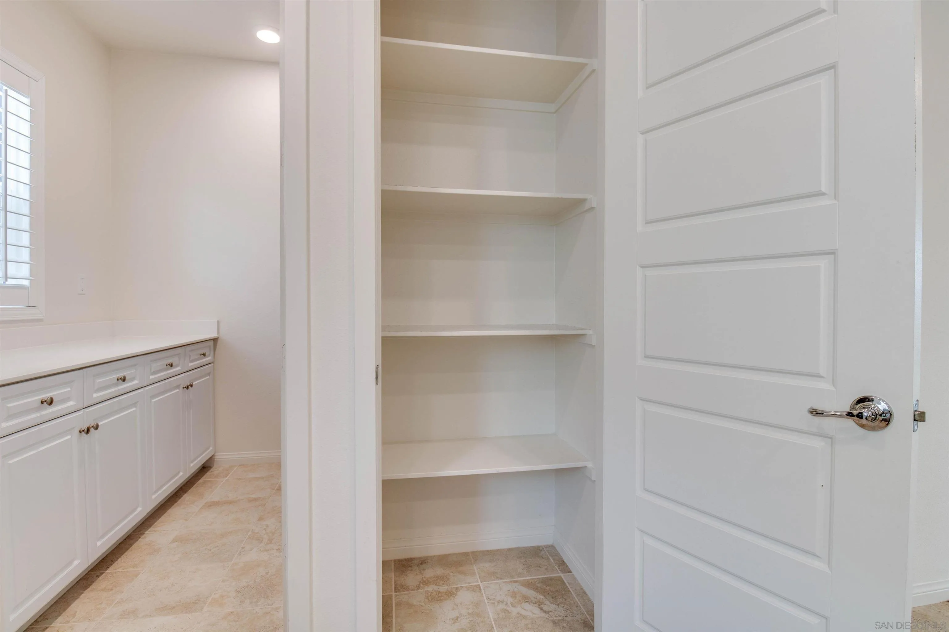 6012 Village Center Loop Road, Unit 35 San Diego, CA 92130 - Photo 11 of 29 a view of walk in closet with empty racks