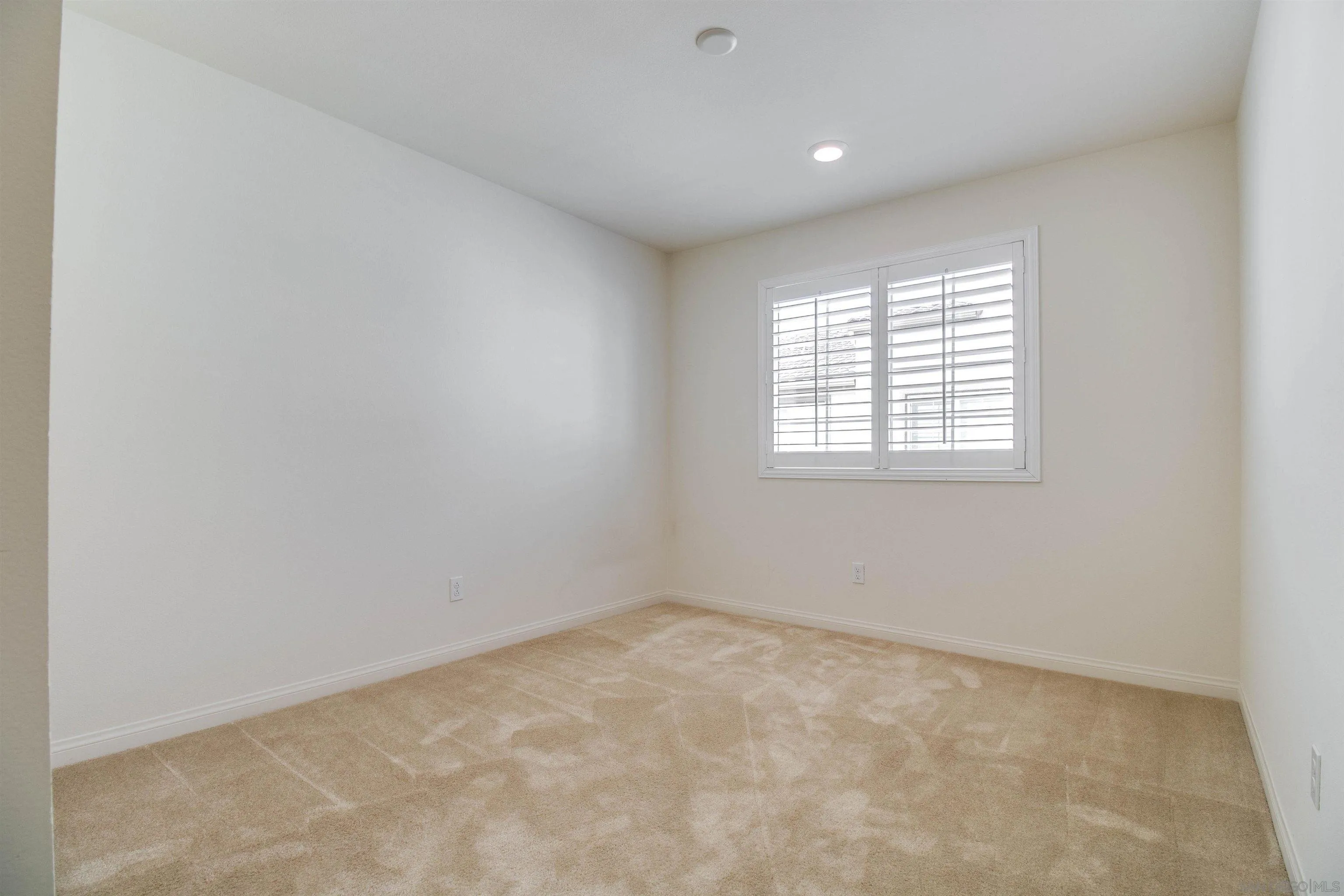 6012 Village Center Loop Road, Unit 35 San Diego, CA 92130 - Photo 16 of 29 an empty room with a window