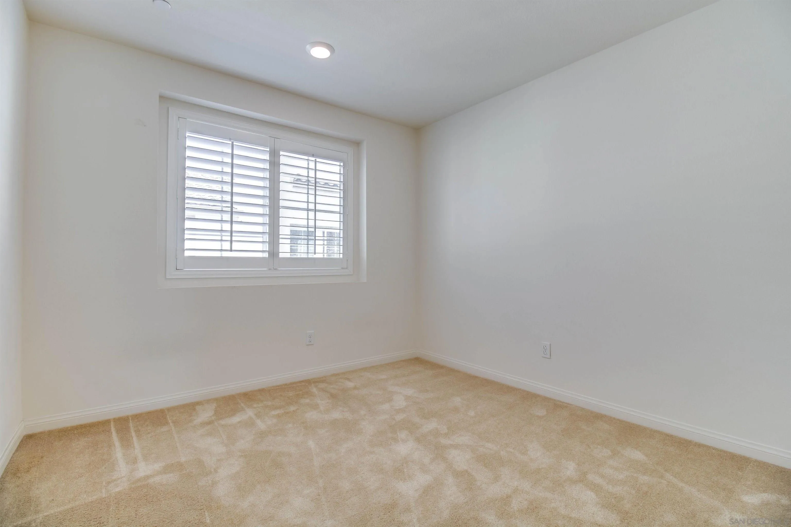 6012 Village Center Loop Road, Unit 35 San Diego, CA 92130 - Photo 18 of 29 an empty room with a window