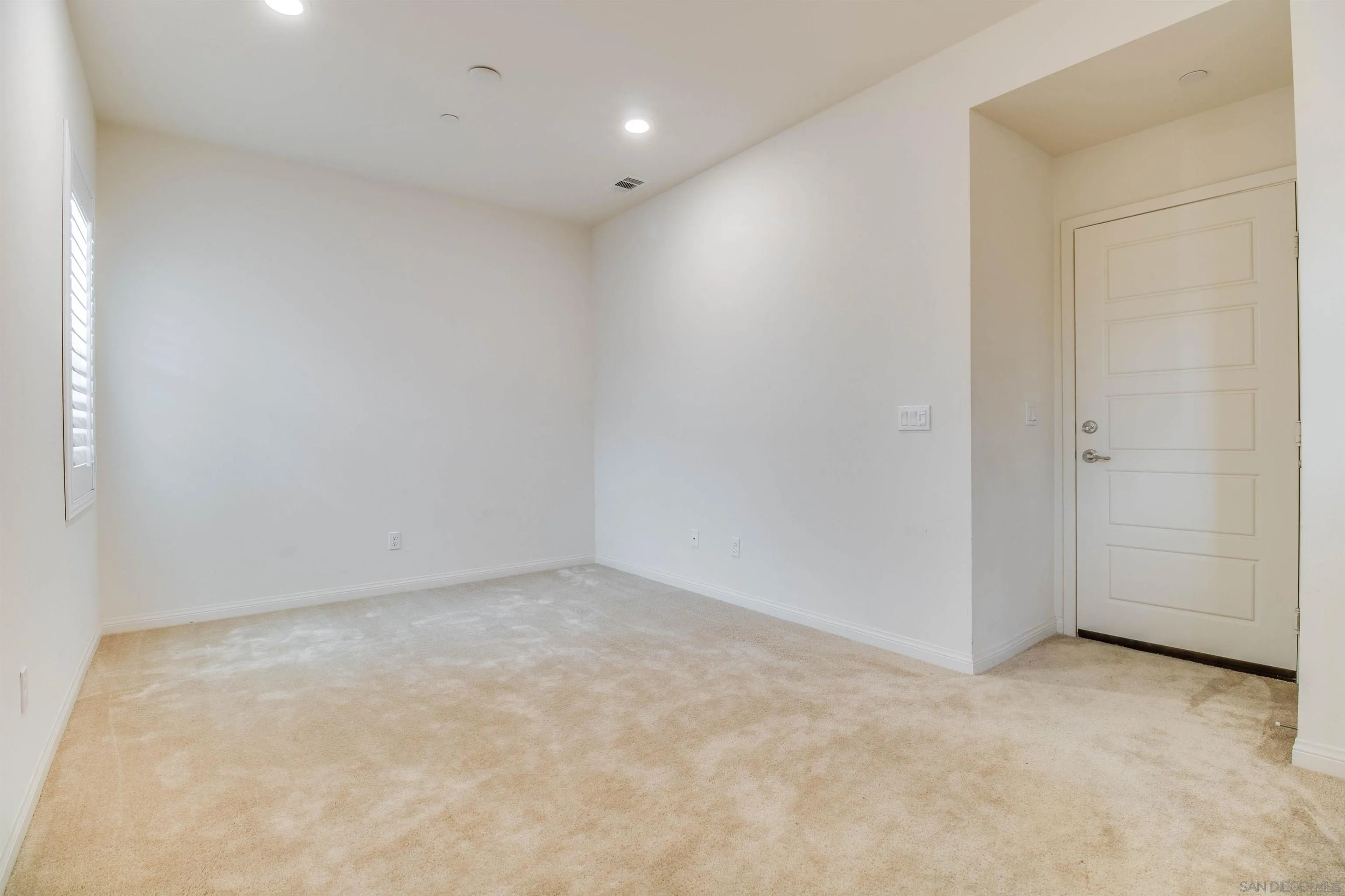 6012 Village Center Loop Road, Unit 35 San Diego, CA 92130 - Photo 8 of 29 an empty room with a natural light