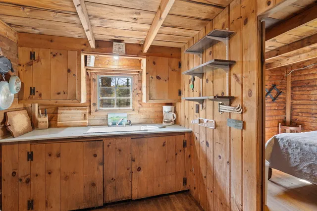 a kitchen with a sink and a window