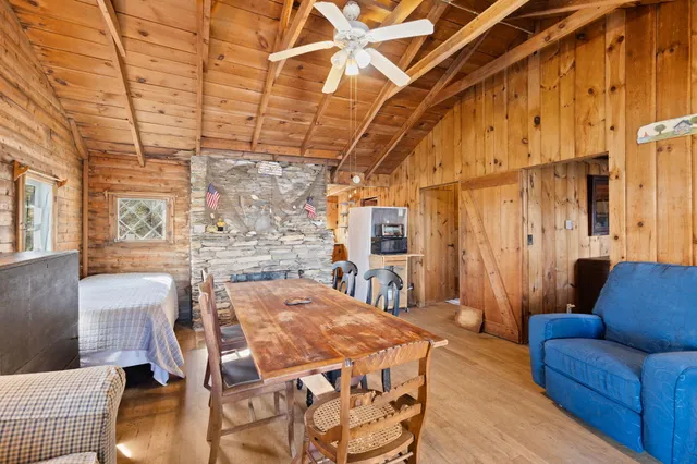 a view of a livingroom with furniture window and wooden floor