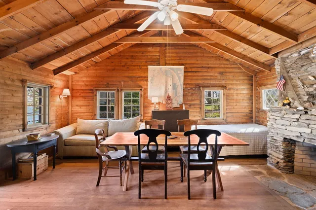 a dining room with furniture and window