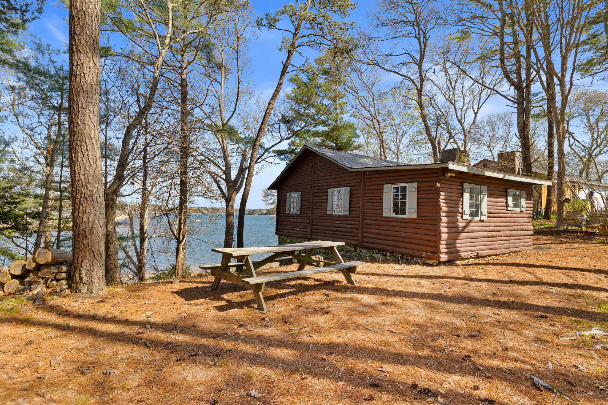 23 Pine Ridge Road Buzzards Bay, MA 02532 - Photo 3 of 27 a backyard of a house with table and chairs