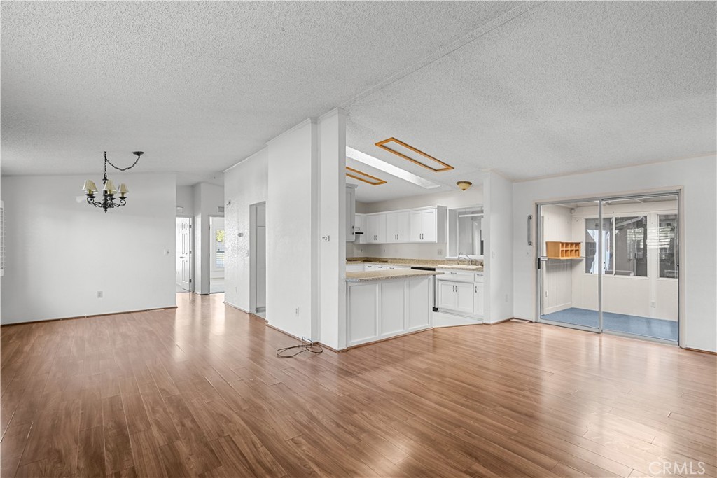 820 Vista Del Rio Santa Maria, CA 93458 - Photo 11 of 57 a view of a kitchen with wooden floor a sink and dishwasher