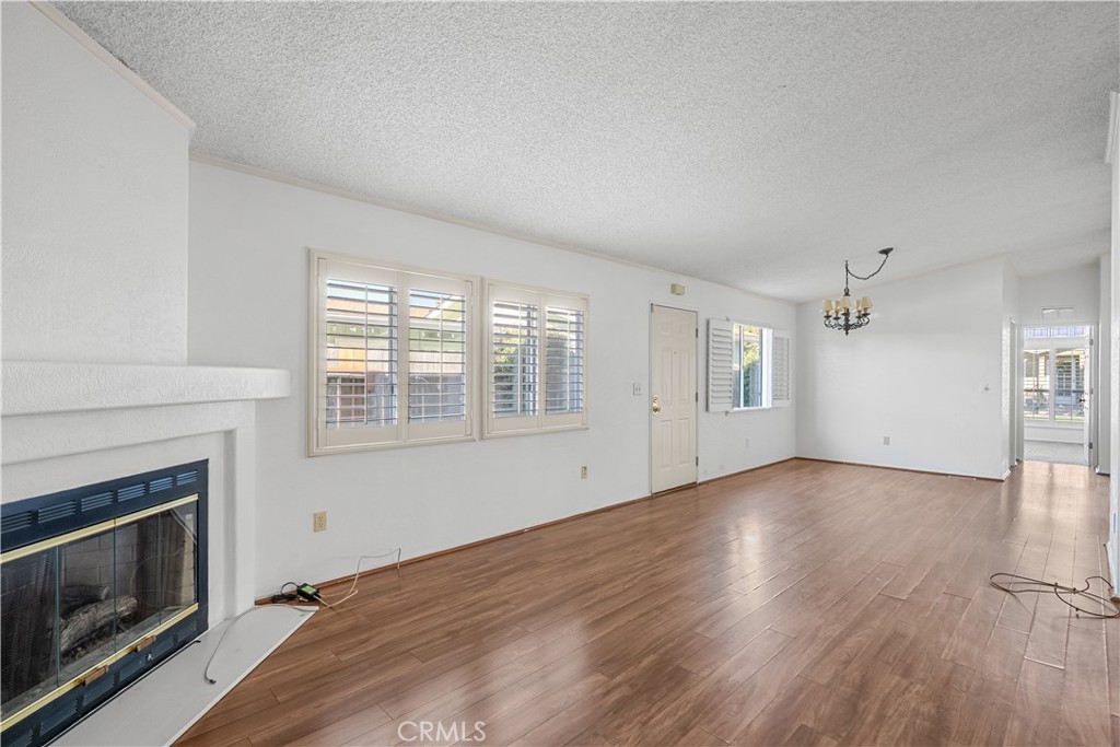 820 Vista Del Rio Santa Maria, CA 93458 - Photo 12 of 57 a view of an empty room with wooden floor and a window
