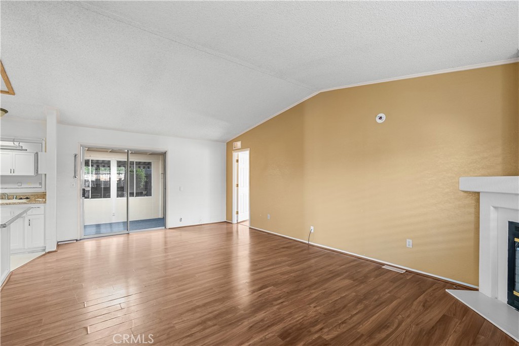 820 Vista Del Rio Santa Maria, CA 93458 - Photo 14 of 57 a view of an empty room with wooden floor and a window