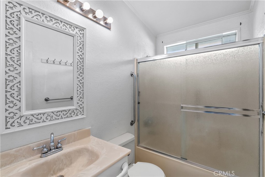 820 Vista Del Rio Santa Maria, CA 93458 - Photo 23 of 57 a bathroom with a granite countertop shower sink vanity and toilet