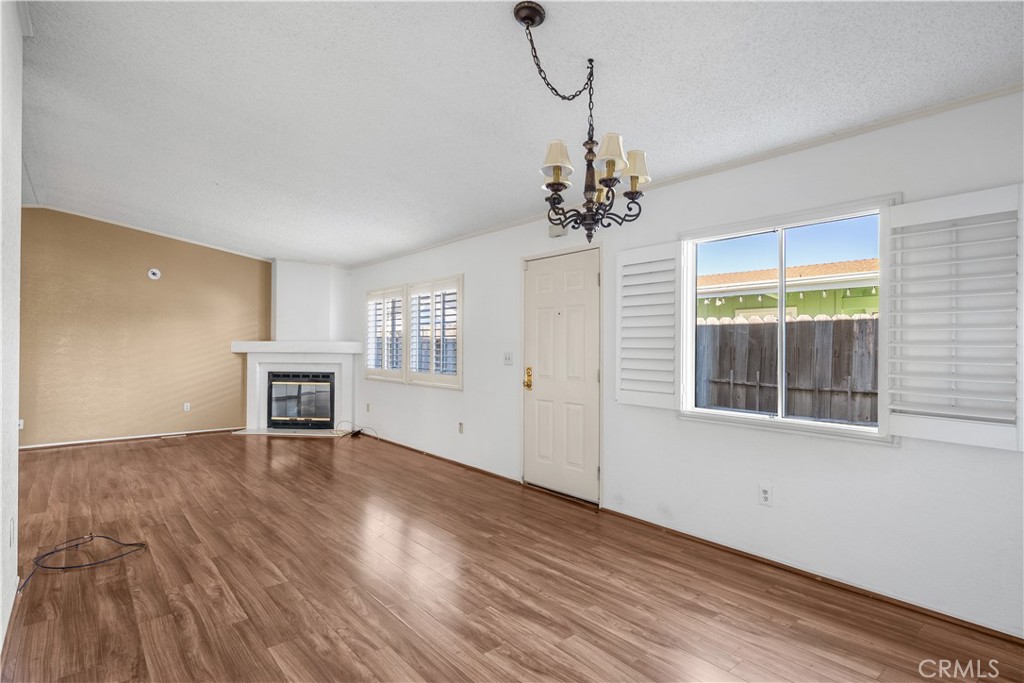 820 Vista Del Rio Santa Maria, CA 93458 - Photo 6 of 57 a view of an empty room with a window and wooden floor