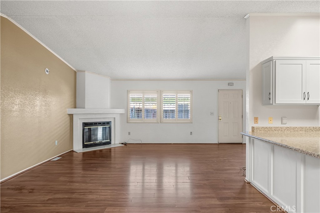 820 Vista Del Rio Santa Maria, CA 93458 - Photo 8 of 57 a view of empty room with wooden floor and fireplace