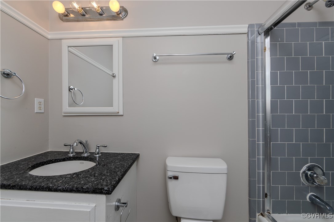 13817 Laurel Spring Road Chester, VA 23831 - Photo 18 of 40 Bathroom featuring walk in shower, vanity, and toi