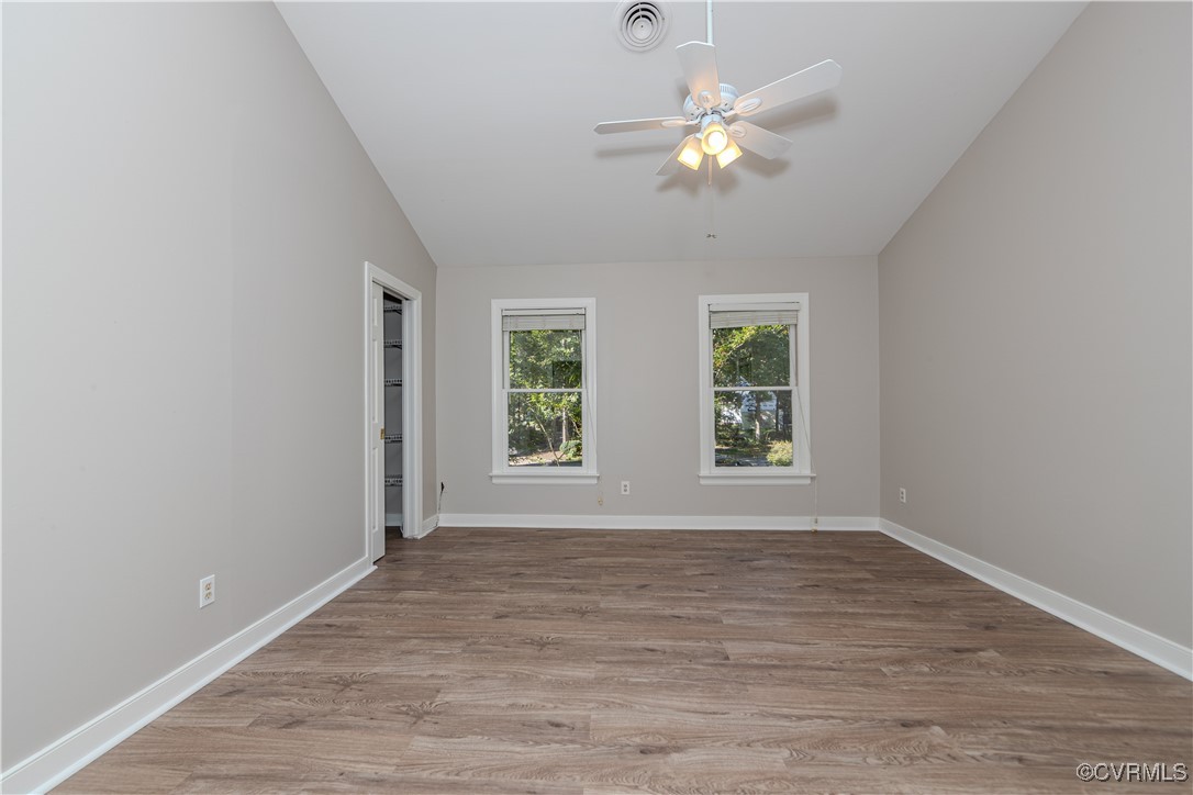 13817 Laurel Spring Road Chester, VA 23831 - Photo 19 of 40 Owner suite with ceiling fan, light wood-type floo