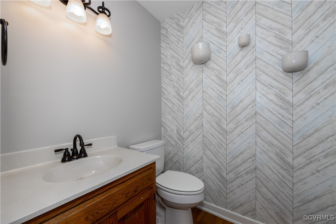 13817 Laurel Spring Road Chester, VA 23831 - Photo 7 of 40 Half bathroom with vanity and toilet