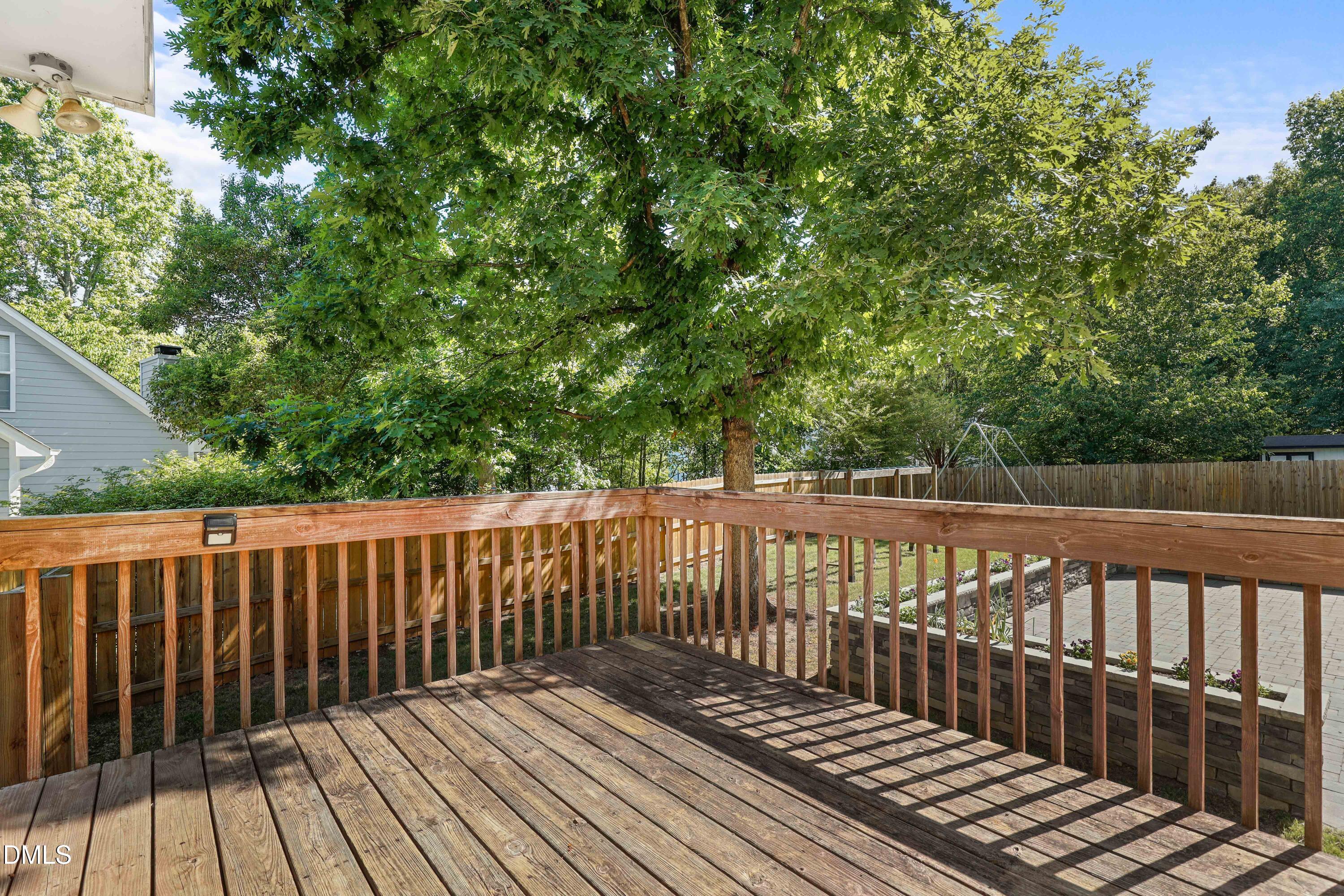 3015 Rennit Court Raleigh, NC 27603 - Photo 37 of 40 a balcony with wooden floor and fence