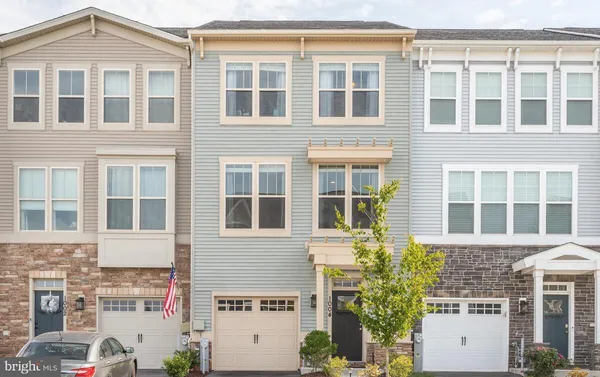 a front view of a building with a lot of windows