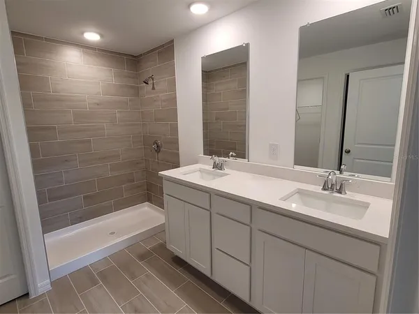 a bathroom with a bathtub and a sink