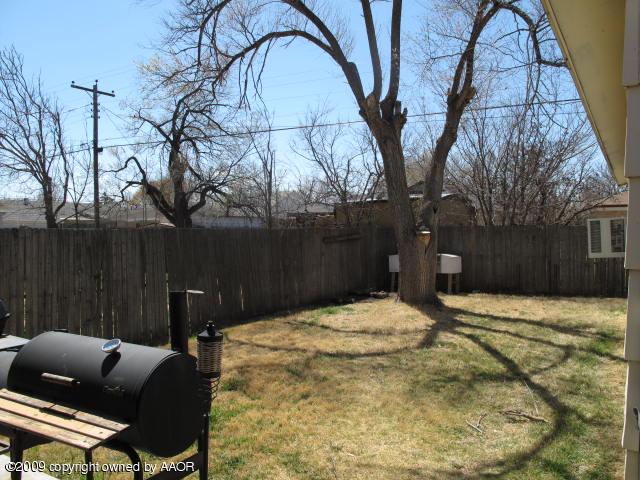 3618 South Ong Street Amarillo, TX 79110 - Photo 15 of 17 a backyard of a house with table and chairs