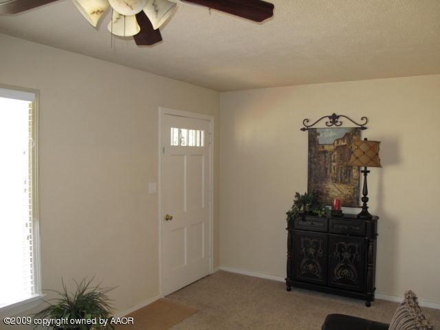 3618 South Ong Street Amarillo, TX 79110 - Photo 3 of 17 a view of room with a hallway