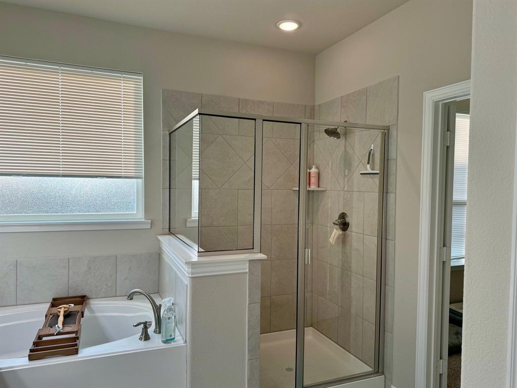 906 Gambel Drive Sherman, TX 75092 - Photo 16 of 26 a bathroom with a shower and a sink