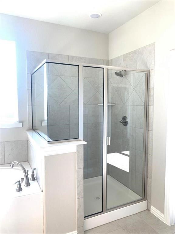 906 Gambel Drive Sherman, TX 75092 - Photo 17 of 26 a bathroom with a shower and a sink