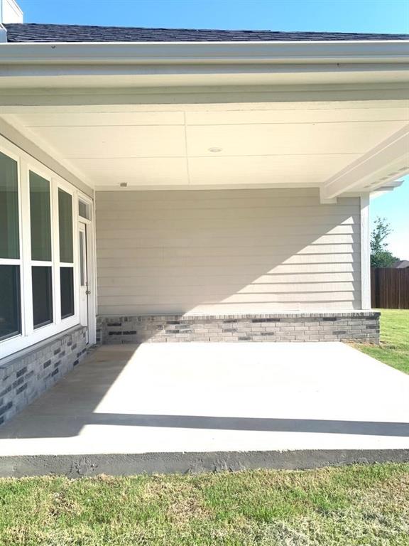 906 Gambel Drive Sherman, TX 75092 - Photo 24 of 26 a view of a room with wooden floor