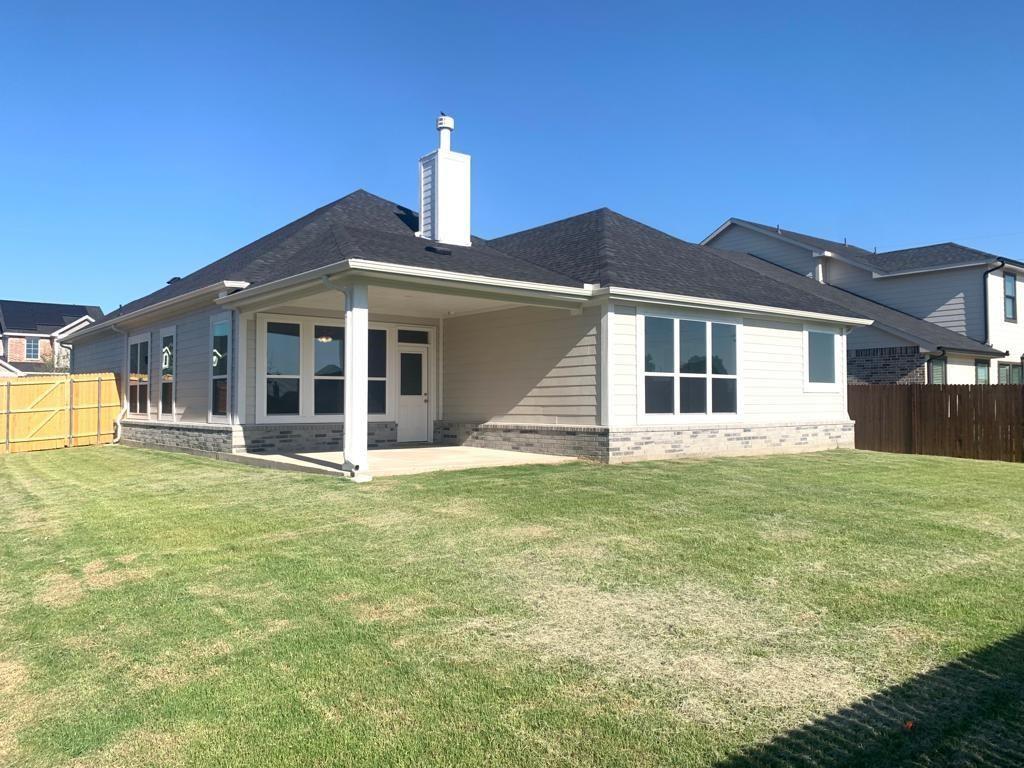 906 Gambel Drive Sherman, TX 75092 - Photo 26 of 26 a front view of a house with a garden
