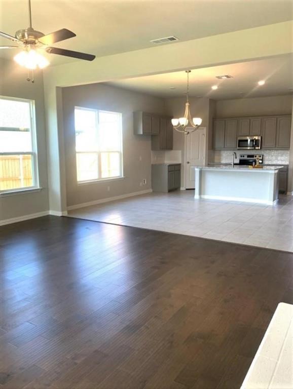 906 Gambel Drive Sherman, TX 75092 - Photo 5 of 26 an open kitchen with a sink and dishwasher with kitchen view