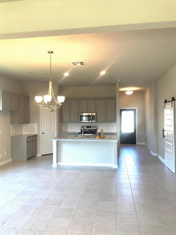 906 Gambel Drive Sherman, TX 75092 - Photo 6 of 26 a view of a room with a chandelier
