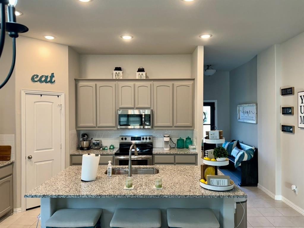 906 Gambel Drive Sherman, TX 75092 - Photo 9 of 26 a kitchen with sink cabinets and appliances