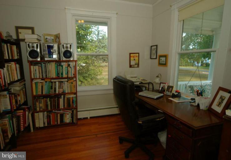 113 Morven Park Road Northwest Leesburg, VA 20176 - Photo 11 of 16 a view of a workspace with furniture and a bookshelf